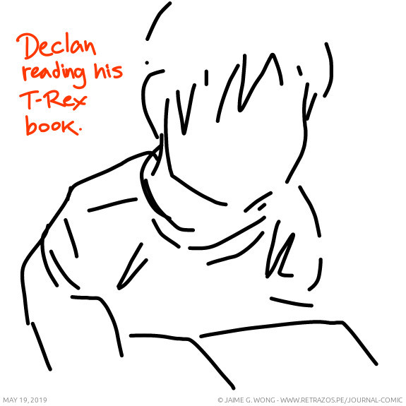 Declan reading his T-Rex book